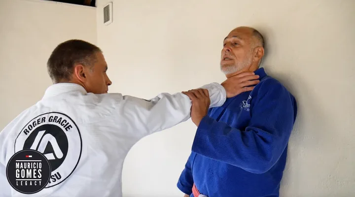 Defence Against a One-Handed Strangle with Back to the Wall